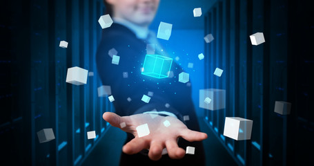 Person holding hologram projection displaying white cubes in server room
