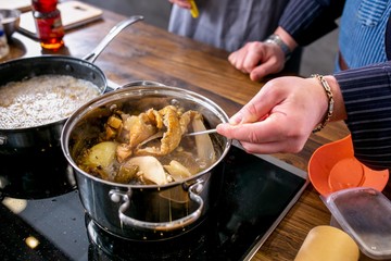 Chef mixes mushrooms in a pan. Master class in the kitchen. The process of cooking. Step by step. Tutorial. Close-up