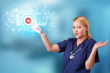 Doctor touching hologram screen displaying medical symbols and charts
