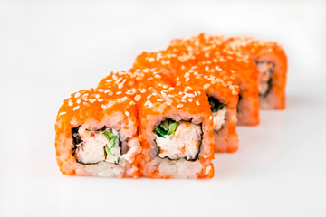 Sushi California Roll with crab meat, cucumber and masago isolated in white background, close-up