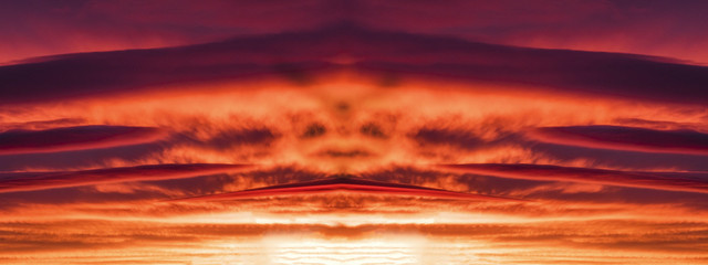 Fototapeta na wymiar the Face in purple clouds at sunset.