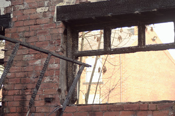 View of window of old derelict brick building