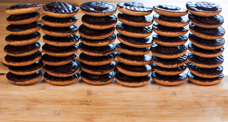Jaffa Cakes - chocolate biscuits in a heap as a food background / design.