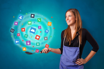 Young happy person cooking applications in wok
