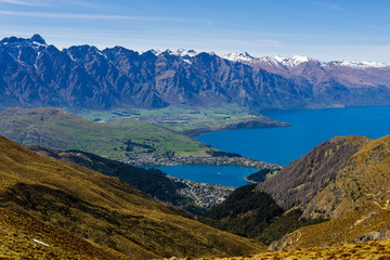 peaceful landscape during sunny day above the lake, valley and mountain range