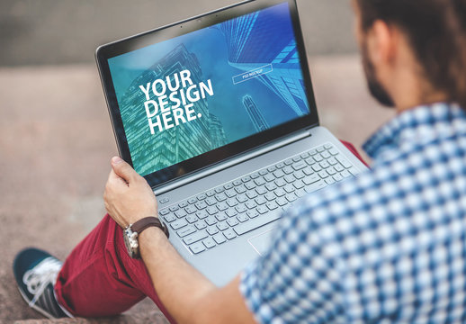 Close View Mockup of a Laptop User Outside