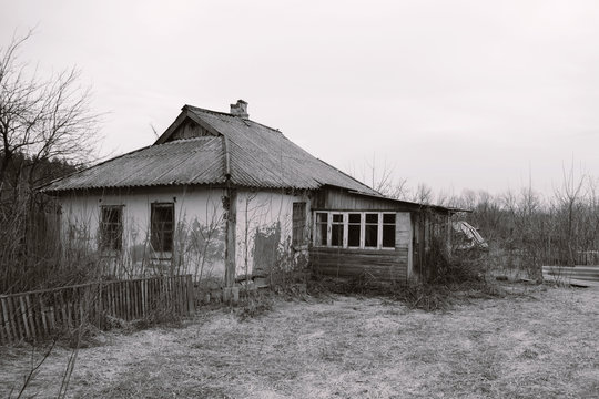 old abandoned earthen house black and white photo