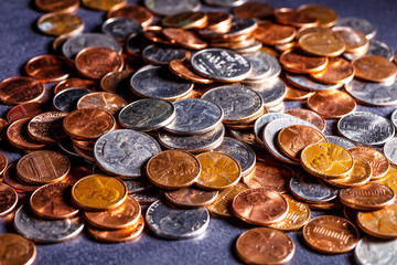 Pile of Golden coin, silver coin, copper coin, quarters, nickels, dimes, pennies, fifty cent piece and dollar coins. Various USA coins, American coins for business, money, financial coins and economy