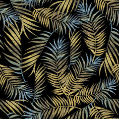 tropical leaves with textures of golden and blue colors on a dark gray background