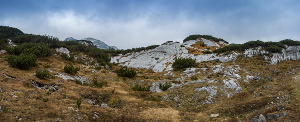Landscape rocky mountains Styrian Alps in Austria. Peaks of rocky hills with occasionally vegetation.