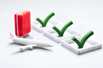 Miniature Plane And Bag Showing Travel Concept