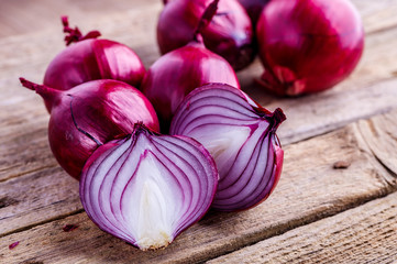 red onions on rustic wood