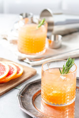 Cocktail with grapefruit juice and rosemary