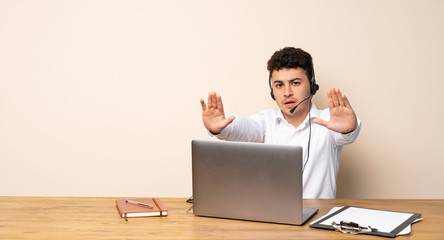 Telemarketer man making stop gesture and disappointed