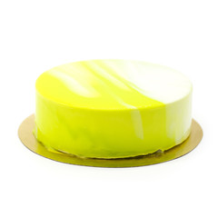yellow lemon cake with strawberry jam on a white plate with berries