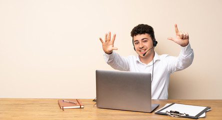 Telemarketer man counting seven with fingers