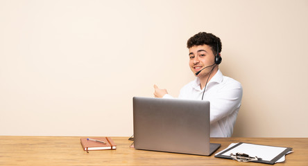 Telemarketer man pointing back