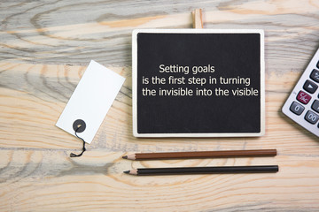 The text Setting goals is the first step in turning the invisible into the visible 