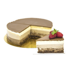 chocolate cake with white chocolate on a white plate with strawberries and mint