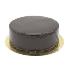 Dark chocolate vegan cake with Candied Oranges on wooden background