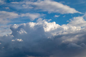 Naklejka na ściany i meble Beautiful dramatic blue sky clouds after rain background