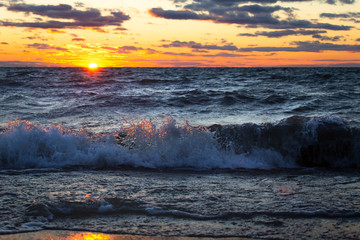 sunset over splashing wave
