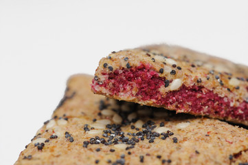 Bunch of integral fruit biscuits with cherries isolated on white background. Healthy food, copy space. Integral biscuit isolated on white backgorund