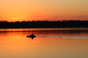 Isolated Kayak at Sunrise on the lake