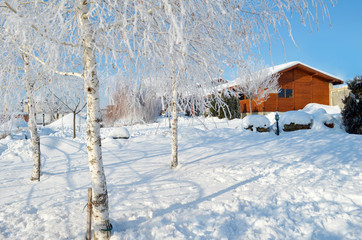 Winter Wooden House on Winter Snowy Panoramic Landscape 