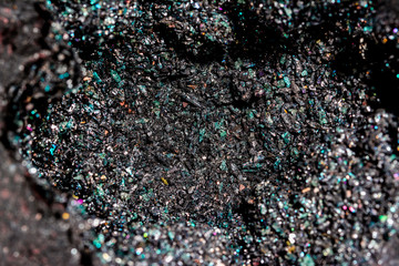 Volcanic bomb inside, filled with olivine and other minerals crystals. Close up macro.