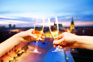 Warsaw Poland downtown with glasses of champagne