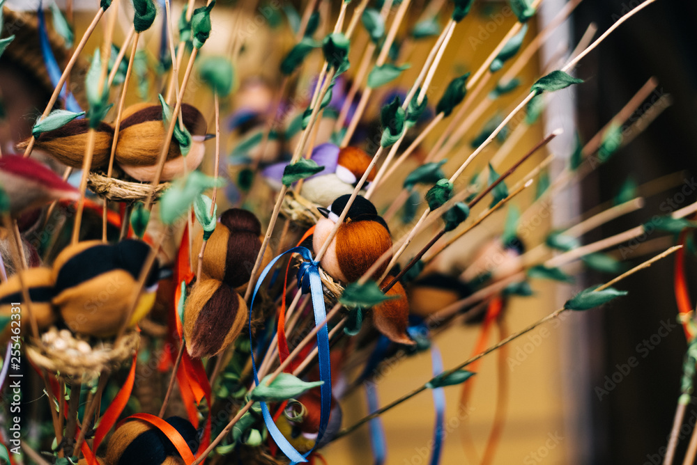 Wall mural bird toy on Shrovetide. homemade birds on the branches