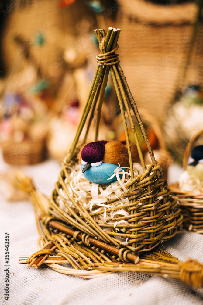 Wall mural bird toy on Shrovetide. homemade birds in baskets