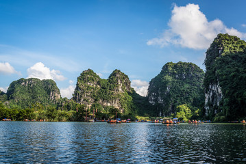 Fototapeta na wymiar Boat ride in Trang An landscape complex, UNESCO World Heritage Site, Ninh Bình Province, Vietnam