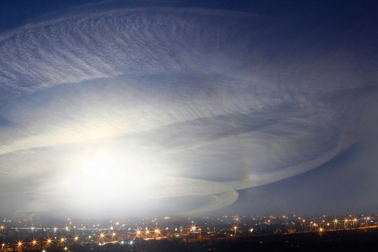 Condensation traces from the aircraft. Dramatic sky at sunset. Selective focus, place for text.