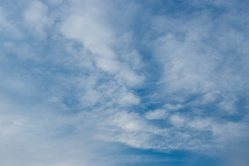 Scattered white clouds on a blue sky.