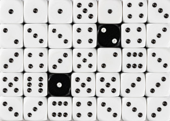 Background of random ordered white dices with two black cubes