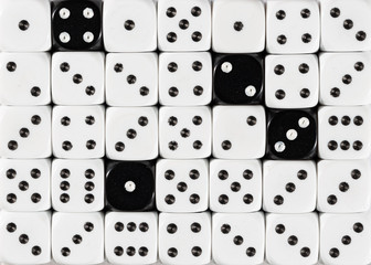 Background of random ordered white dices with four black cubes