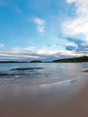 Beach shore with cloudy sky at Congwong Beach, Sydney, Australia.