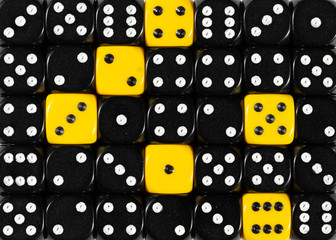 Background of random ordered black dices with six yellow cubes