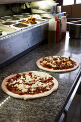 Making pizza at restaurant.