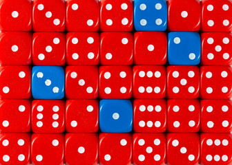 Background of random ordered red dices with four blue cubes