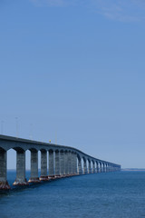 The confederation bridge spanning across  the northumberland strait to Prince Edward Island in Canada's Eastern province