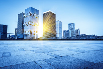 Fototapeta premium Urban skyscrapers with empty square floor tiles