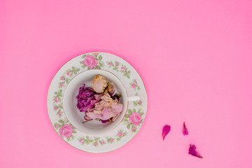 China tea cup filled with dried flower petals