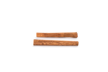 Two cinnamon sticks isolated on white background. Spice concept.