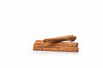 A few cinnamon sticks isolated on white background. Spice concept.