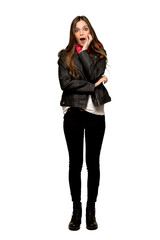 Full-length shot of Young woman with leather jacket surprised and shocked while looking right on isolated white background