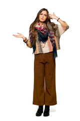 Full-length shot of Young hippie woman making the gesture of madness putting finger on the head on...