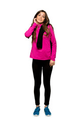 Fototapeta premium Full-length shot of Young sport woman having doubts over isolated white background